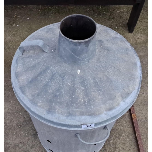 30 - Galvanized metal garden incinerator with chimney lid and side handles, perforated for airflow.