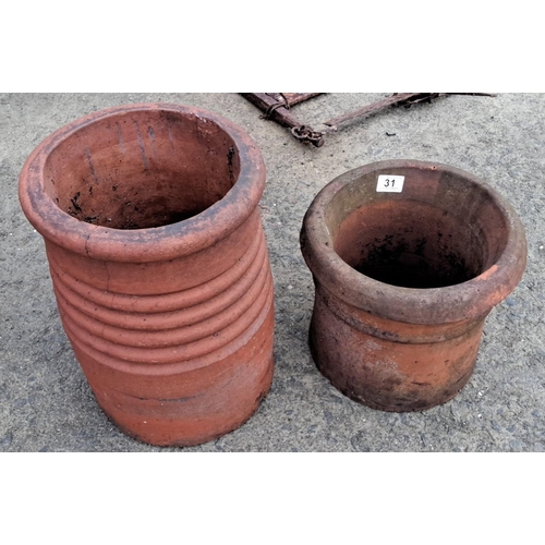 31 - Pair of vintage terracotta chimney pots, tall and ribbed. Rustic charm with natural patina.