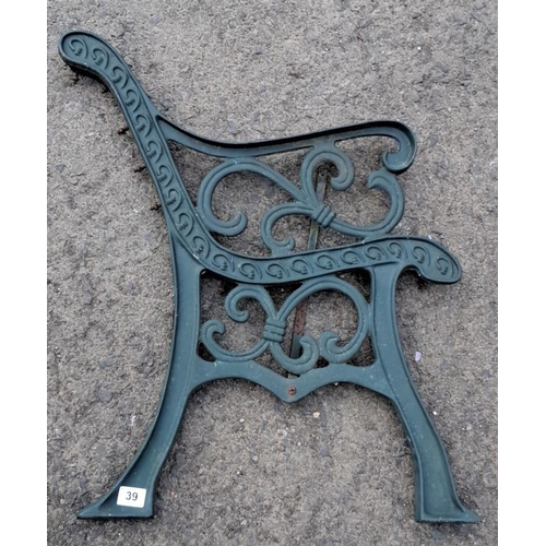 39 - Pair of ornate cast iron bench ends with scroll design.