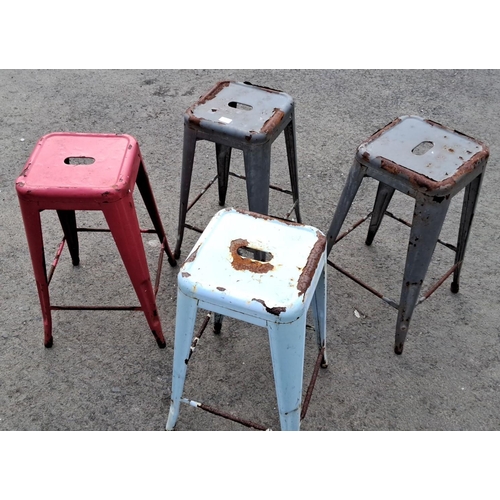 42 - Set of four vintage industrial metal stools, multi-colored with distinctive rustic patina.