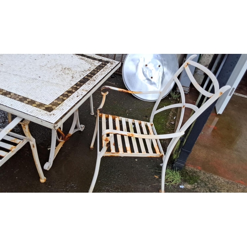 53 - Outdoor metal patio set with six chairs and rectangular table, featuring intricate lattice design.