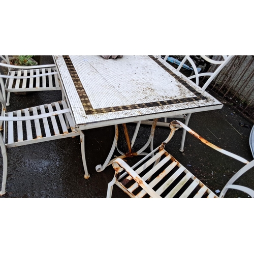 53 - Outdoor metal patio set with six chairs and rectangular table, featuring intricate lattice design.