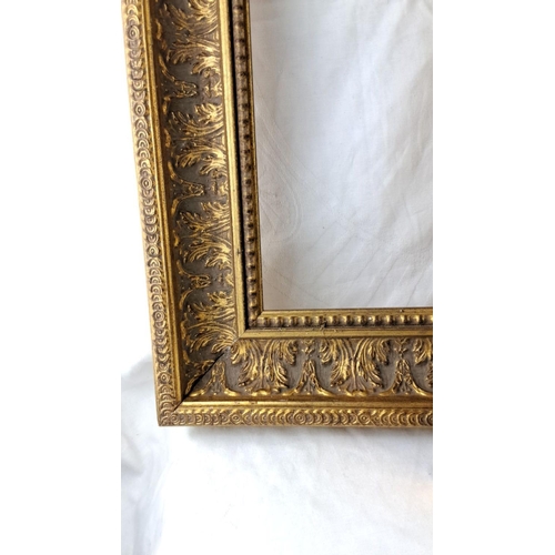 57 - Set of three gilded ornate frames, featuring intricate leaf motifs.