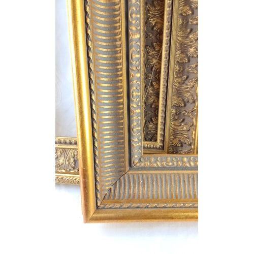 57 - Set of three gilded ornate frames, featuring intricate leaf motifs.