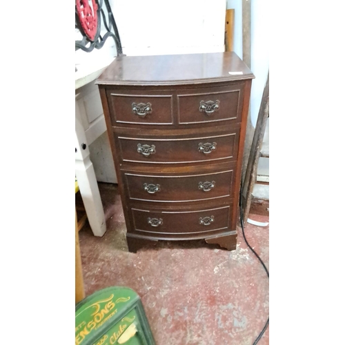 58 - Bow-fronted mahogany chest of drawers, featuring two small over three large drawers with decorative ... 