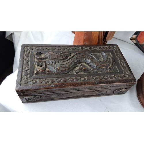 59 - Assorted collection of carved wooden items featuring a decorative box with dragon motif, multicolore... 