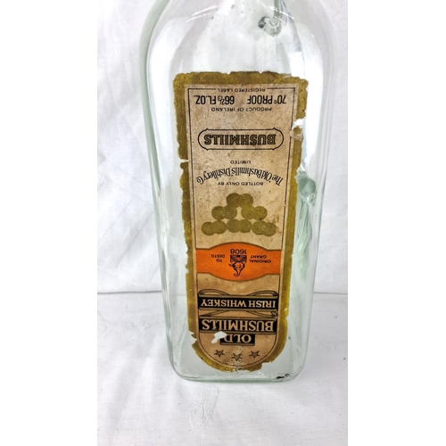 71 - Vintage Bushmills Old Whiskey bottle, featuring original label and distinct Irish branding. A piece ... 