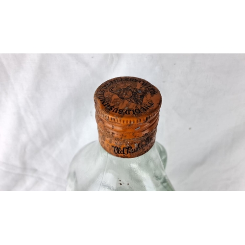 71 - Vintage Bushmills Old Whiskey bottle, featuring original label and distinct Irish branding. A piece ... 