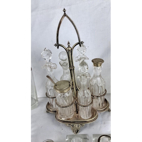 92 - Vintage crystal liquor set with silver accents includes a decanter, cocktail shaker, ice bucket, and... 