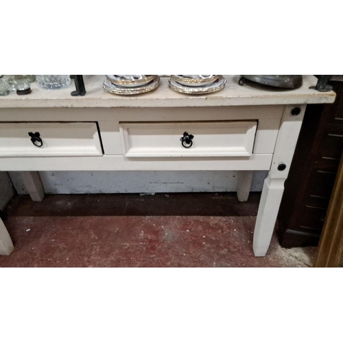 93 - Painted wooden side table with two drawers and black metal ring pulls.