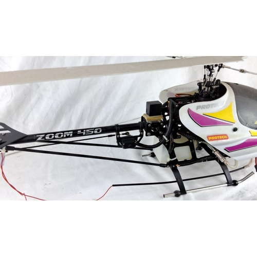 98 - Protech Zoom 450 model helicopter features aerodynamic design and vivid branding.