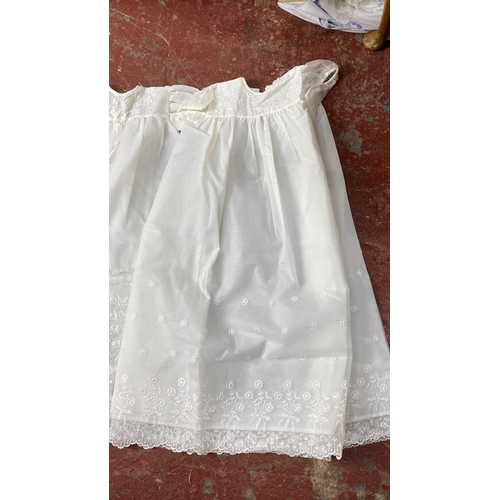 218 - Two 1960's christening robes, a Broderie Pearse pram set and a Victorian under slip.