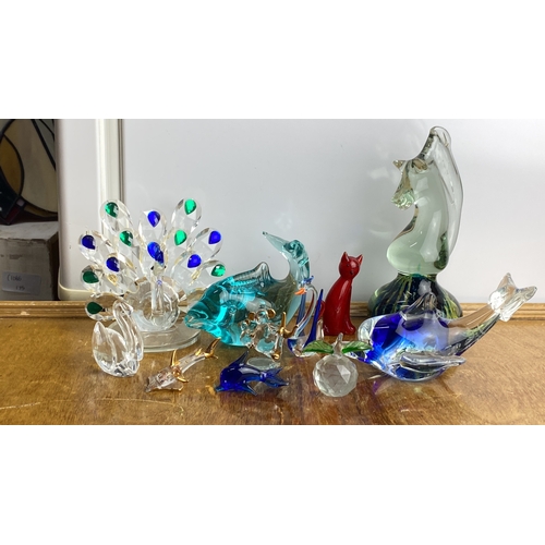 236 - Collection of glass animal figurines and sculptures, including a peacock, dolphin, cat, and various ... 