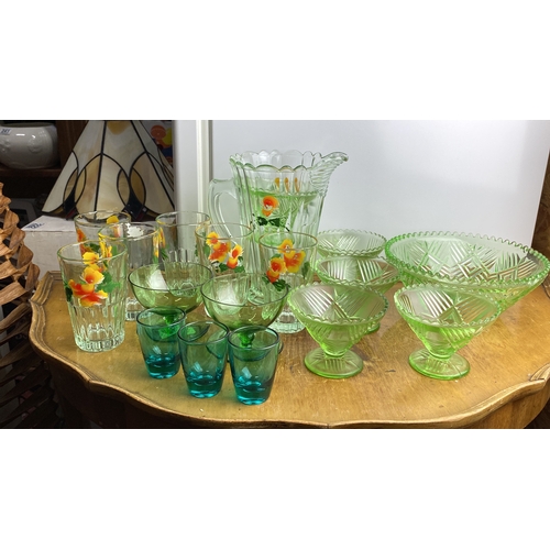 240 - Collection of vintage glassware features a floral-etched water pitcher, matching tumblers, green gla... 