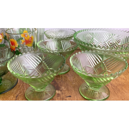 240 - Collection of vintage glassware features a floral-etched water pitcher, matching tumblers, green gla... 