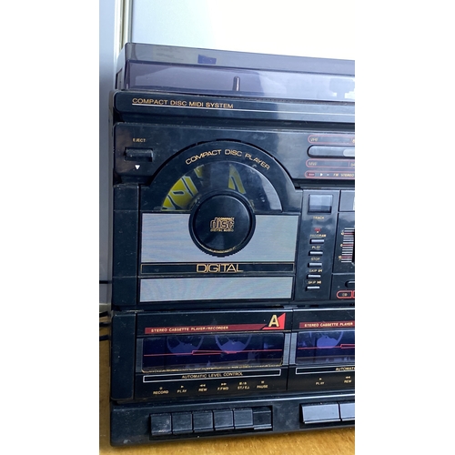 262 - Vintage Compact Disc Midi System with stereo cassette and record player, featuring digital audio tec... 