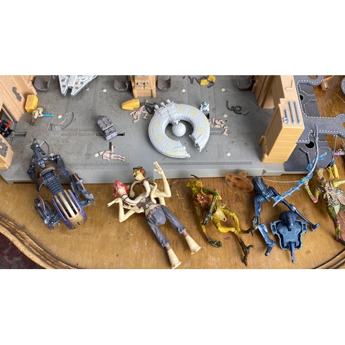 265 - Star Wars playset includes detailed figurines and ships, featuring miniatures of Millennium Falcon, ... 