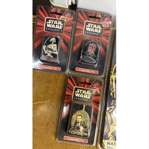 268 - Collection of Star Wars memorabilia includes five pin badges and three collectible watches (LCD and ... 