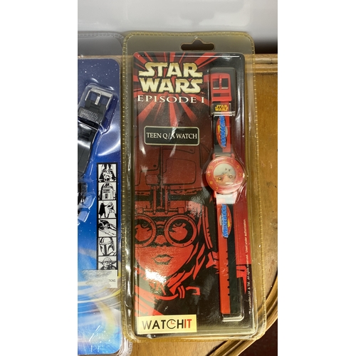 268 - Collection of Star Wars memorabilia includes five pin badges and three collectible watches (LCD and ... 