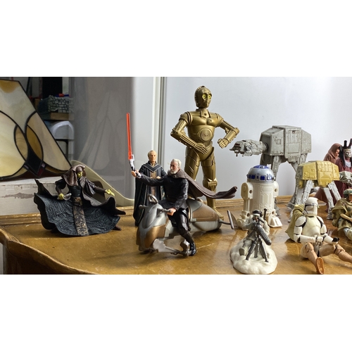 271 - Collection of Star Wars action figures featuring iconic characters and vehicles, including droids an... 