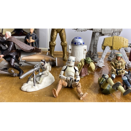 271 - Collection of Star Wars action figures featuring iconic characters and vehicles, including droids an... 