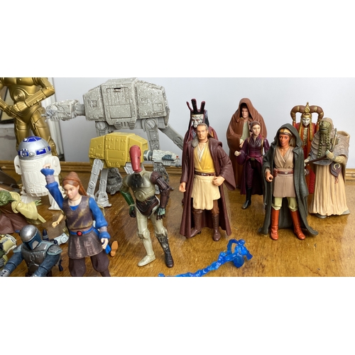 271 - Collection of Star Wars action figures featuring iconic characters and vehicles, including droids an... 