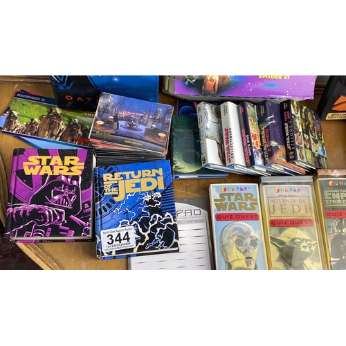 280 - Star Wars collectible lot featuring books, Quiz Wiz games, trading cards, and a Star Wars-themed ele... 