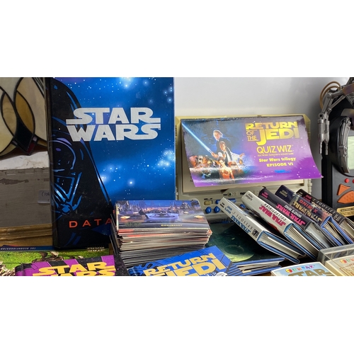 280 - Star Wars collectible lot featuring books, Quiz Wiz games, trading cards, and a Star Wars-themed ele... 