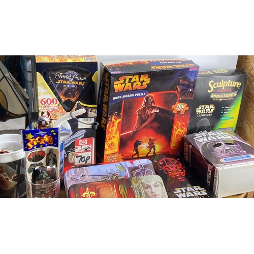 292 - Mixed lot including Star Wars themed puzzles, trivia game, stickers, and collectible tins. Includes ... 