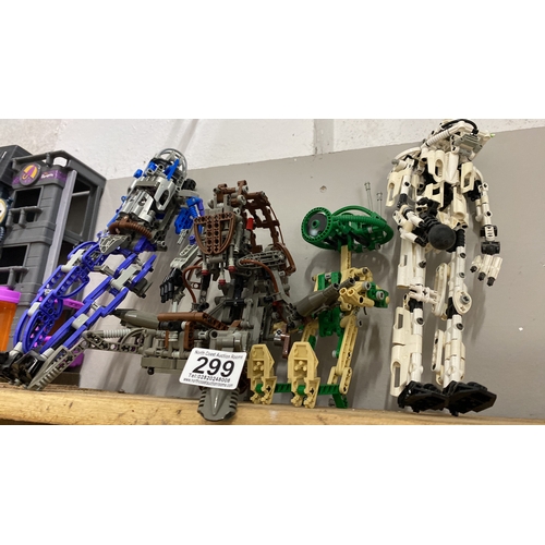 299 - LEGO Bionicle action figures, set of four. Constructed with diverse colored pieces, showcasing intri... 