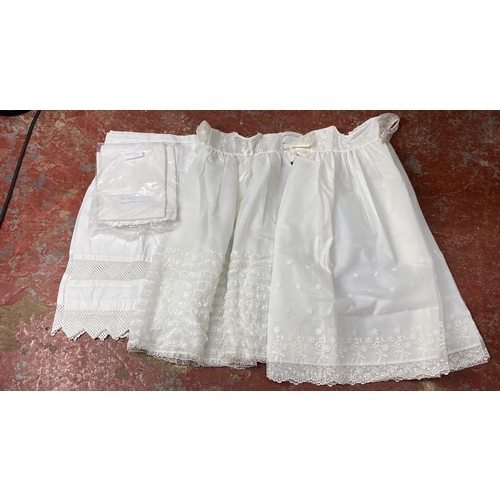 218 - Two 1960's christening robes, a Broderie Pearse pram set and a Victorian under slip.