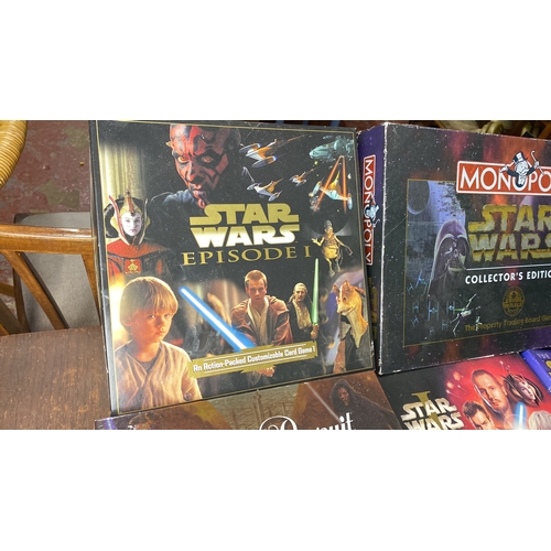 300 - Collection of Star Wars board games and books, including Monopoly Collector's Edition, Trivial Pursu... 