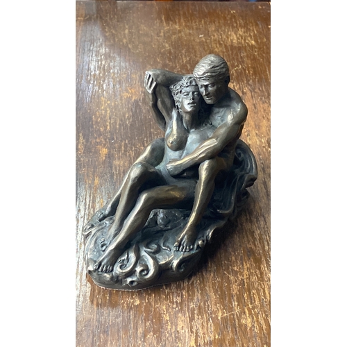 304 - Bronze effect sculpture by Genisis, depicting an embracing couple.