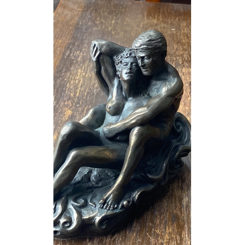 304 - Bronze effect sculpture by Genisis, depicting an embracing couple.