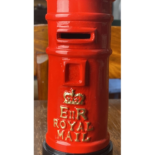 311 - A novelty Royal Mail metal money box. Measuring approx 20cm tall