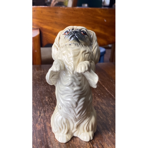 316 - Beswick England porcelain figurine, depicting a seated Pekingese dog with detailed finish. Stamped o... 