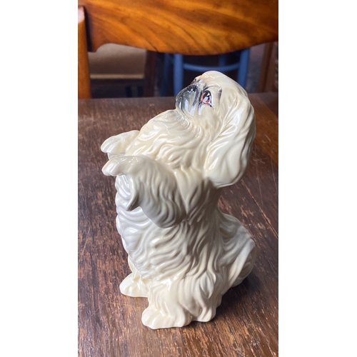 316 - Beswick England porcelain figurine, depicting a seated Pekingese dog with detailed finish. Stamped o... 