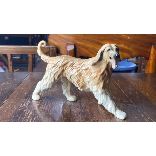 319 - Royal Doulton ceramic dog figurine, Afghan Hound, from the mid-20th century, marked on base. Hand-pa... 