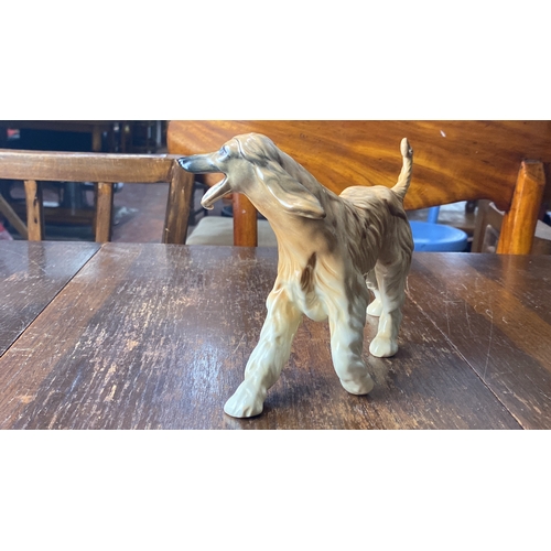 319 - Royal Doulton ceramic dog figurine, Afghan Hound, from the mid-20th century, marked on base. Hand-pa... 