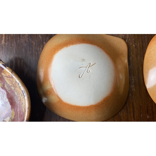 323 - Set of four glazed ceramic dishes with abstract splatter design. Artist's mark on the base.