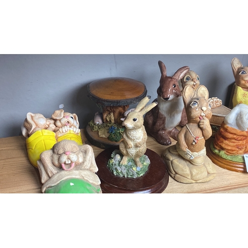 327 - Collection of ceramic rabbit figurines, various styles and colours.