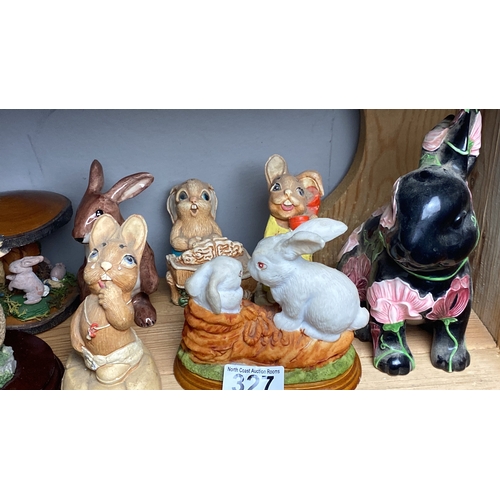 327 - Collection of ceramic rabbit figurines, various styles and colours.