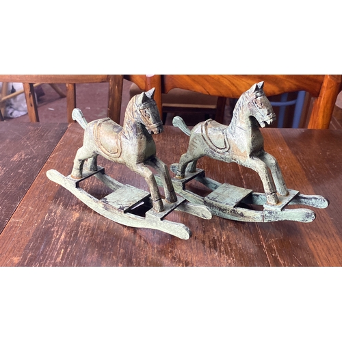 330 - Pair of vintage wooden rocking horse sculptures with distressed finish.