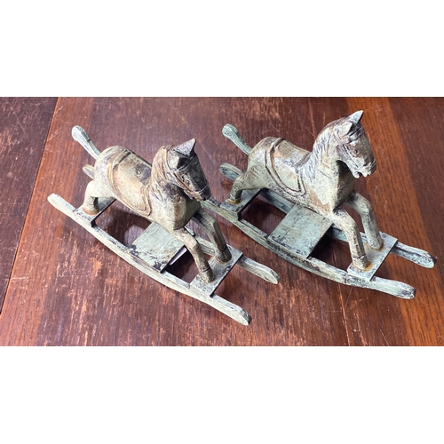 330 - Pair of vintage wooden rocking horse sculptures with distressed finish.