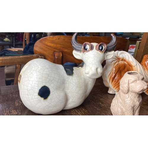 346 - Ceramic cow and dog figurines, Mid-century style. The dog is inscribed 