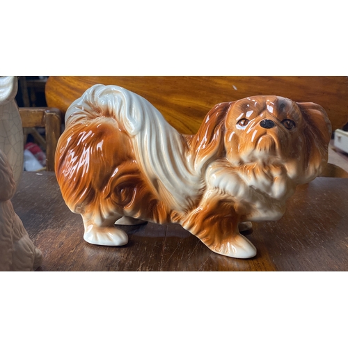 346 - Ceramic cow and dog figurines, Mid-century style. The dog is inscribed 