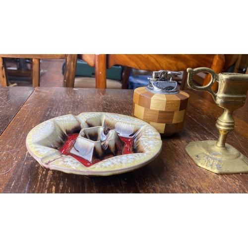 351 - Mid-Century modern pottery ashtray, teak and metal table lighter, and brass candlestick.