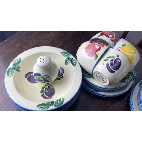 354 - Poole Pottery 'Dorset Fruits' tableware set features vibrant fruit motifs, England.