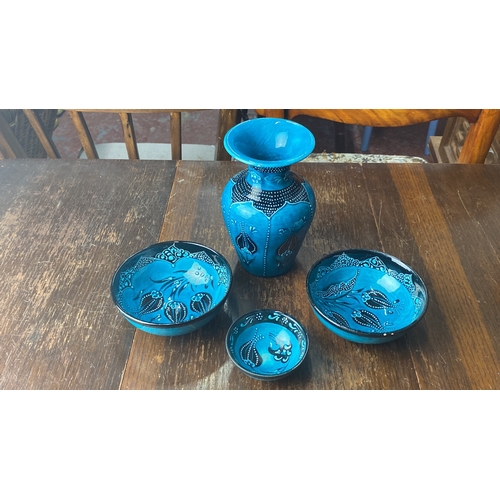 355 - Turkish-style ceramic bowl set features intricate blue designs. Signed by artist on base.