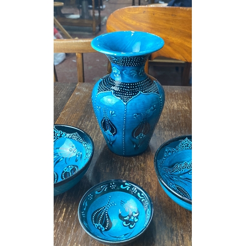 355 - Turkish-style ceramic bowl set features intricate blue designs. Signed by artist on base.